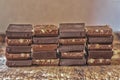 Pieces of different milk chocolate are carefully laid out in a staggered order Royalty Free Stock Photo