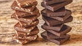 Pieces of different milk chocolate are neatly arranged in columns Royalty Free Stock Photo