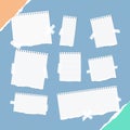 Pieces of different size ruled white note, notebook, copybook sheets, strips stuck with sticky tape on squared blue Royalty Free Stock Photo