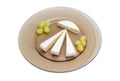 Pieces of different soft cheese and grapes on glass dish