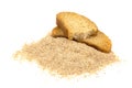 Pieces of dried bread and breadcrumbs isolated on white