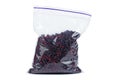 Pieces dried red beetroot in plastic packet isolated on white