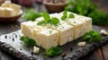 Pieces of feta cheese with mint on dark background