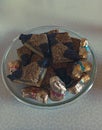 Pieces of fresh brownie on wooden plate with isolated on white background and copy space, selective focus Chocolate Royalty Free Stock Photo