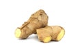 Pieces of fresh ginger placed against white background