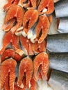 Pieces of fresh red fish cut for steak lying in a showcase in ice Royalty Free Stock Photo