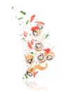 Pieces of fresh sushi with chopsticks frozen in the air Royalty Free Stock Photo