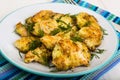 Pieces of fried chicken in breadcrumbs on plate Royalty Free Stock Photo