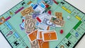 Pieces for the game Monopoly by Hasbro on a white background.  Concept business Royalty Free Stock Photo