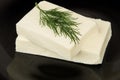 Pieces of goat cheese and bunch of dill Royalty Free Stock Photo