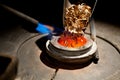 Pieces of gold loaded into furnace for melting