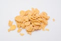 Pieces of golden corn flakes on white Royalty Free Stock Photo