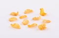 Pieces of golden corn flakes on white background Royalty Free Stock Photo