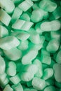 Pieces of green styrofoam in carton box background Royalty Free Stock Photo