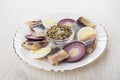 Pieces of herring, boiled eggs, slices of red onion Royalty Free Stock Photo