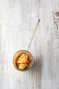 Pieces of candied orange peel coated in sugar in jar Royalty Free Stock Photo