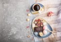 A pieces of homemade chocolate with coconut candies and a cup of coffee on a gray concrete background. top view, copy space Royalty Free Stock Photo