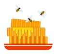 Pieces of honeycomb with flying bees around flat isolated