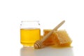 Pieces of honeycomb, glass jar and dipper isolated