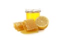 Pieces of honeycomb, glass jar and lemon isolated