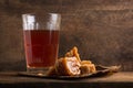 Jaggery or unrefined sugar or palm sugar with a glass of tea