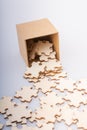 Pieces of jigsaw puzzle out of box as problem solution concept Royalty Free Stock Photo