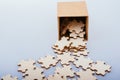 Pieces of jigsaw puzzle out of box as problem solution concept Royalty Free Stock Photo