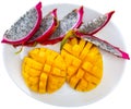 Pieces of mango and thin pieces of pitaya Royalty Free Stock Photo