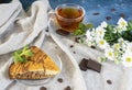 Pieces of marble cake and chocolate lie on a light napkin Royalty Free Stock Photo