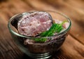 Pieces of the marinated carp in bowl on wooden table Royalty Free Stock Photo