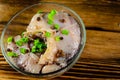 Pieces of the marinated carp in bowl on wooden table Royalty Free Stock Photo