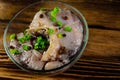 Pieces of the marinated carp in bowl on wooden table Royalty Free Stock Photo