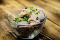 Pieces of the marinated carp in bowl on wooden table Royalty Free Stock Photo