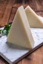 Pieces of matured pecorino romano italian cheese made from sheep milk in Lazio, Sardinia or Tuscany Royalty Free Stock Photo