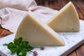 Pieces of matured pecorino romano italian cheese made from sheep milk in Lazio, Sardinia or Tuscany Royalty Free Stock Photo