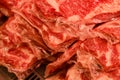 Pieces of meat in polyethylene lie in a heap Royalty Free Stock Photo