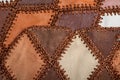 Pieces of multi-colored leather stitched with thread. The front and back side, suede. Royalty Free Stock Photo