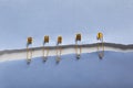 Pieces of paper sheets joined with safety pins on white background, top view Royalty Free Stock Photo