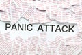 Pieces of paper and text PANIC ATTACK on white background