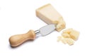 Pieces of Parmesan cheese and knife on white background Royalty Free Stock Photo