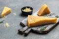 Pieces of parmigiano reggiano or parmesan cheese, Hard cheese, olives, rosemary. place for text, top view