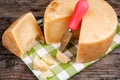 Pieces of pecorino parmesan cheese with special knife Royalty Free Stock Photo