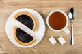 Pieces of pie with blueberry jam, cup of tea, sugar Royalty Free Stock Photo