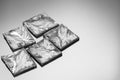 Pieces of polycrystalline silicon on grey background