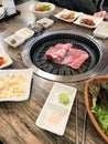Pieces of pork are frying in korean BBQ grill Royalty Free Stock Photo