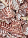 Meat texture chunks arranged in a row in a large in the meat market. Selective focus. Vertical photo