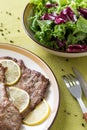 Pieces of prepared meat with lemon