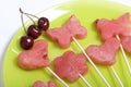 Pieces of the pulp of watermelon are cut with a stamp. They are given different forms. Stringed on skewers for a picnic. There are