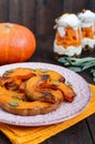 Pieces of pumpkin baked with herbs. Royalty Free Stock Photo