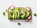 Pieces of radishes on a rectangular slice of bread spread with avocado cream Royalty Free Stock Photo